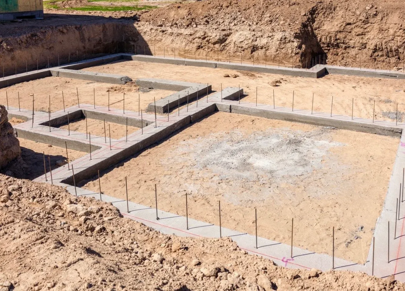 Foundation with concrete footings and steel rebar for a construction project